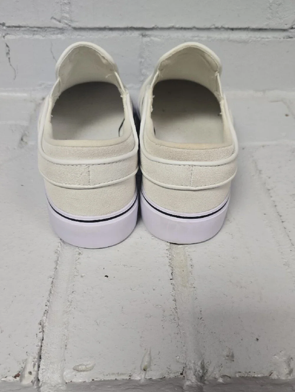 Nike Slip-On Sneakers in Off-White with Black Swoosh